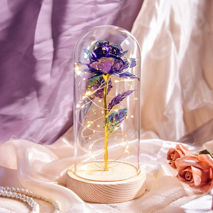 Preserved rose gift on bedside table creating romantic ambiance with LED light