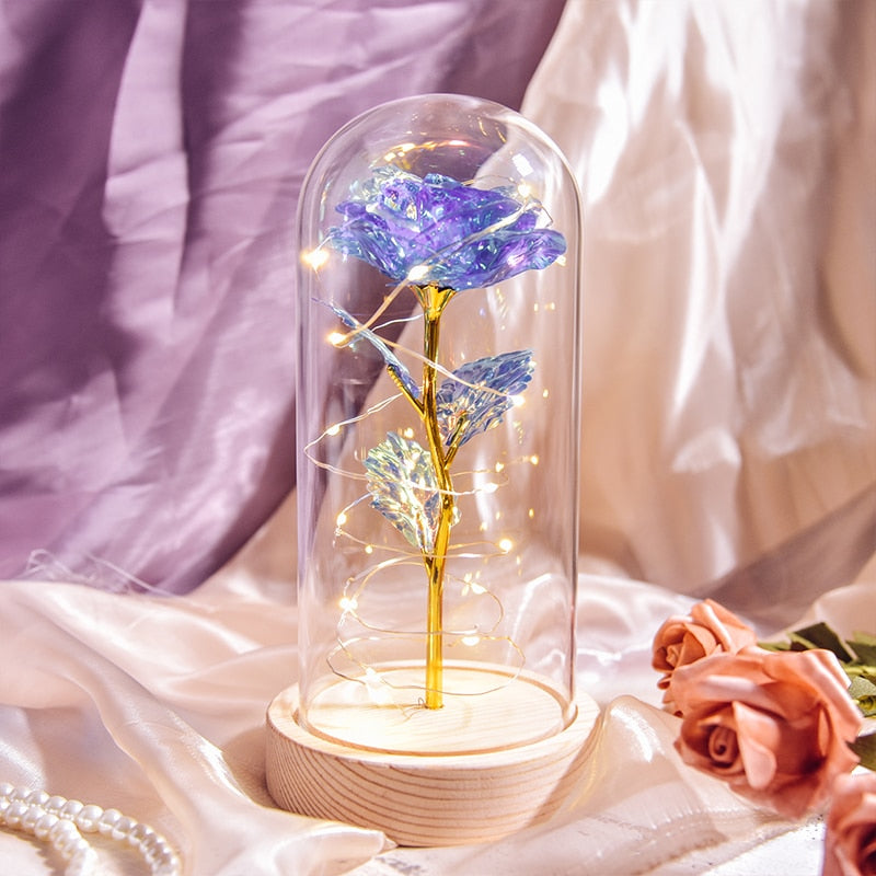 Preserved rose gift on bedside table creating romantic ambiance with LED light