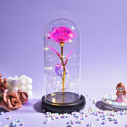 Preserved rose gift on bedside table creating romantic ambiance with LED light