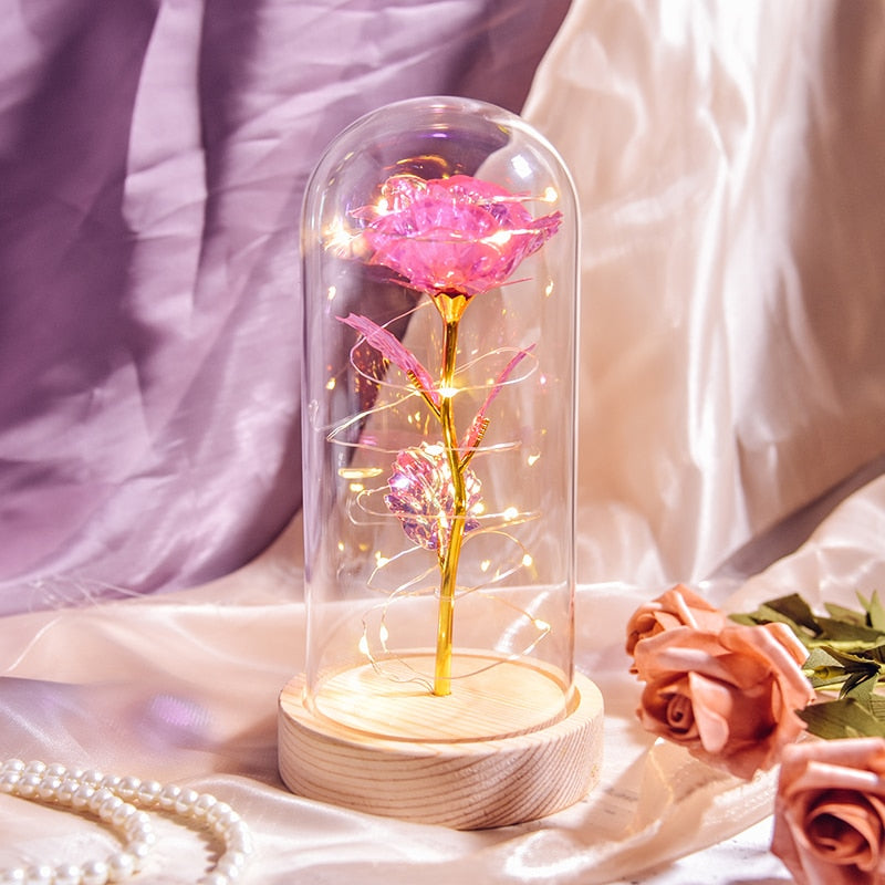 Preserved rose gift on bedside table creating romantic ambiance with LED light